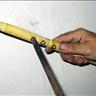 Figure 9: Making the holes in the traditional method which is done by using a hot metal stick