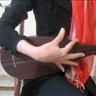 Figure 5: The way of playing the Tanbur by all five fingers