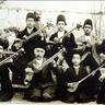 Figure 1: The tar player from the Qajar period. The second person from the left in the front row is Mirza Abdollah
